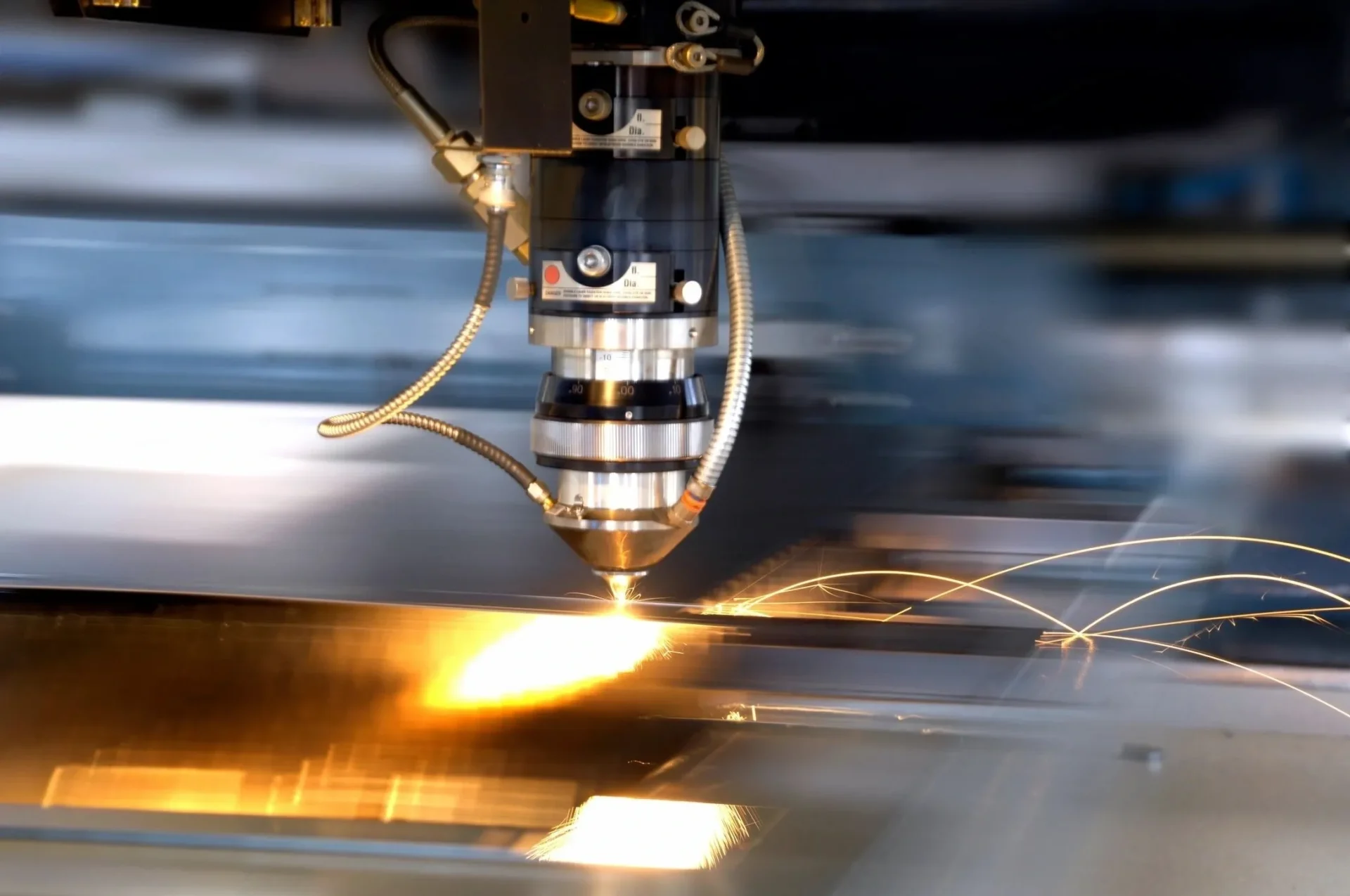 A machine cutting metal with sparks flying