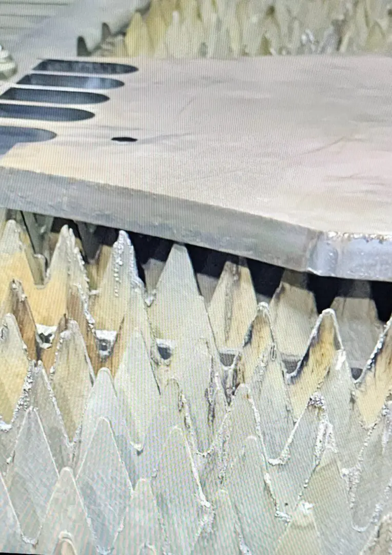 A close up of the blade on a table saw