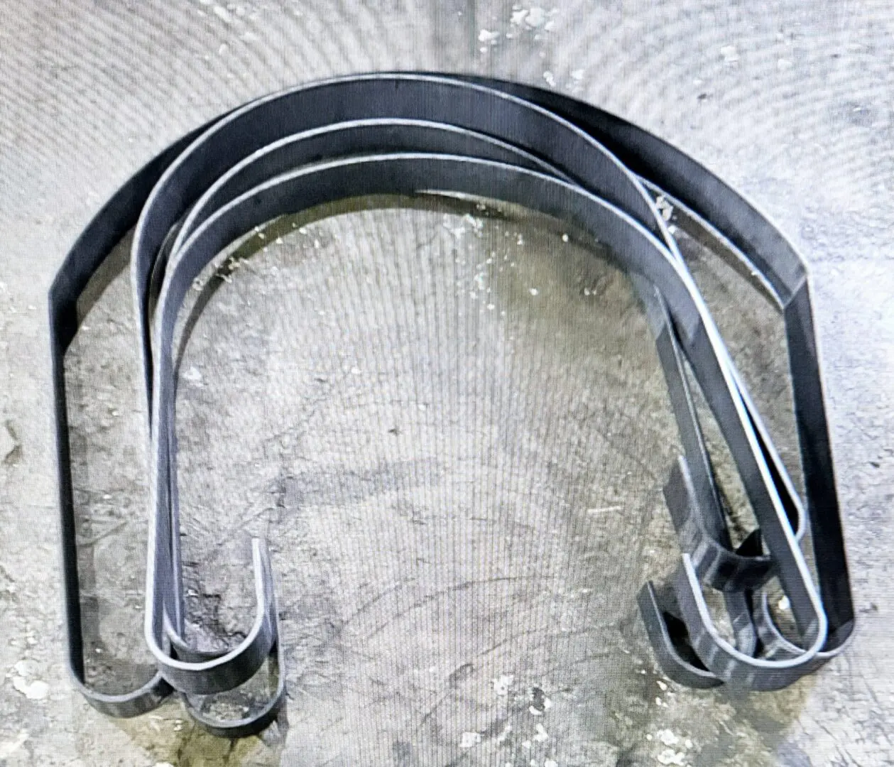 A metal object with some type of curved structure.