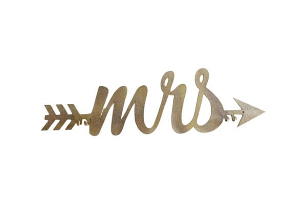 A gold sign that says mrs with an arrow.