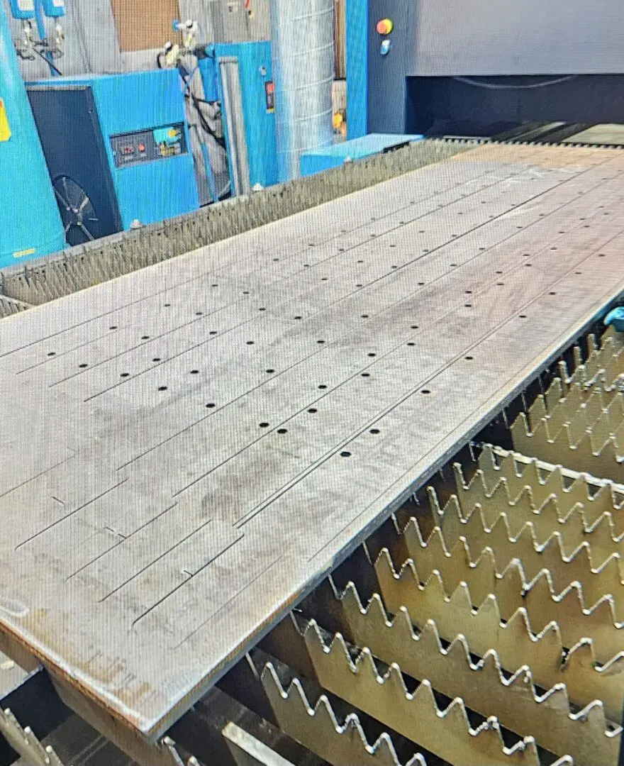 A large metal sheet sitting on top of a floor.