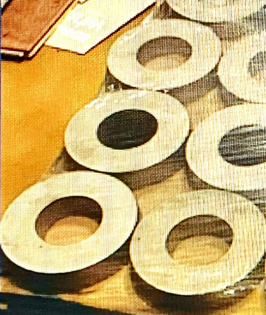 A table with many wooden rings on it