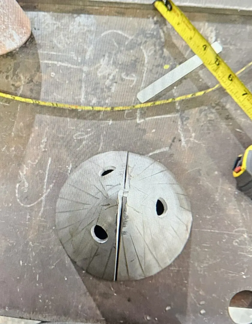 A metal object sitting on top of the floor.