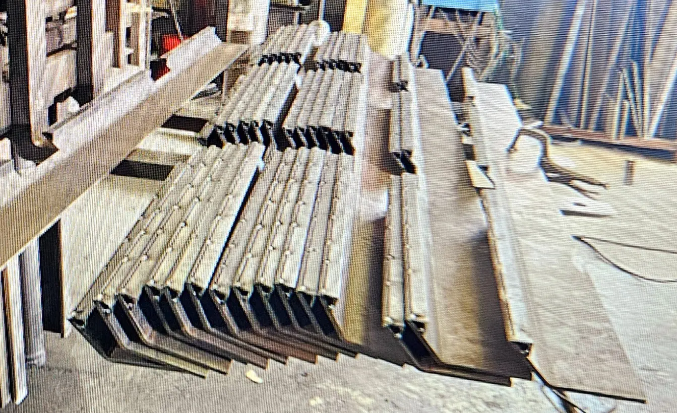 A pile of metal bars sitting on top of each other.