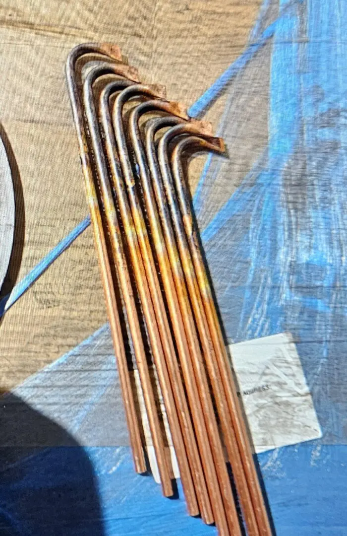 A close up of the strings on an instrument