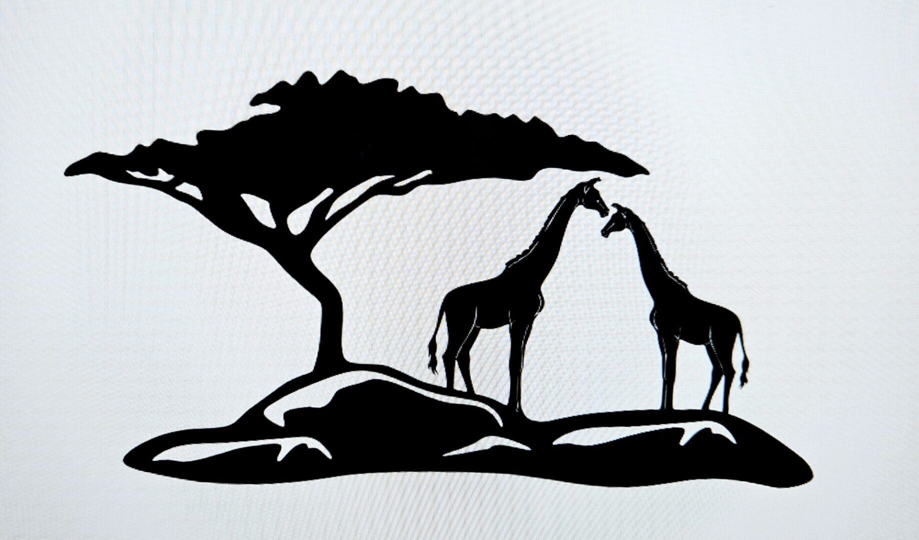 Two giraffes standing next to a tree.